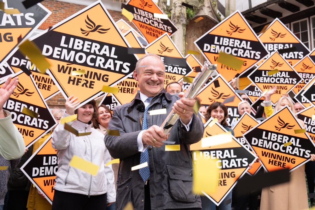 Liberal Democrat leader Sir Ed Davey is greeted by Tory 'dinosaurs' as he arrives to join local Lib Dem campaigners at a celebratory rally in Winchester, following the results in local government elections. Picture date: Friday May 3, 2024.