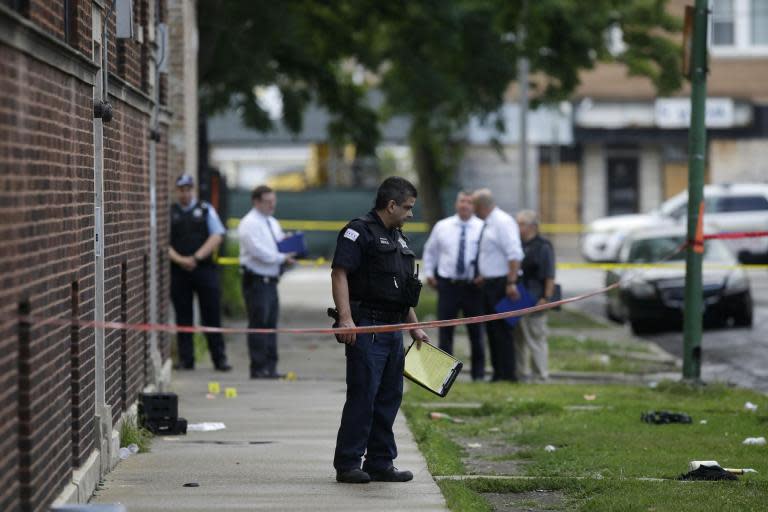 Chicago police appeal for help after more than 66 shot and 12 killed during weekend of gun violence