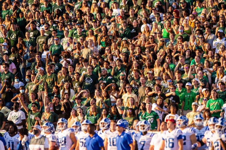 Fans cheer for the Charlotte 49ers during the game against Duke at Jerry Richardson Stadium on Friday, September 3, 2021 in Charlotte, NC. Ahead of the season opener on Friday, UNC Charlotte officials announced game day protocols for fan safety. All spectators five years and older were encouraged to wear masks during the game against the Blue Devils. Officials say fans can pull down their masks when actively eating or drinking.