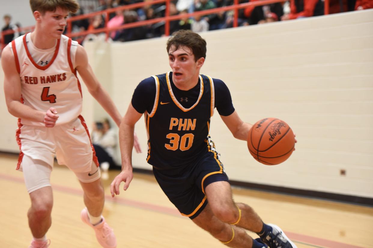 Port Huron Northern's Alex Jamison drives baseline during a game earlier this season.