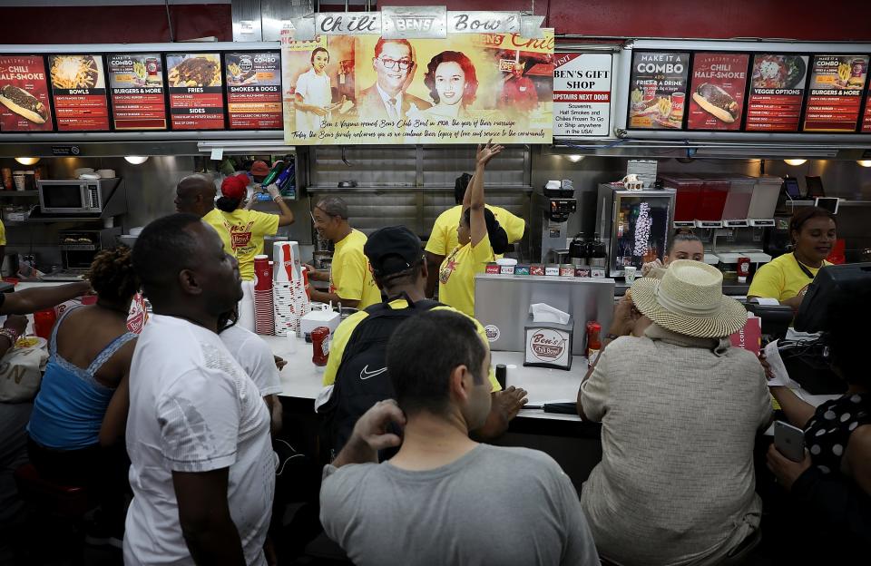 Residents enjoy the 60th birthday block party for area landmark Ben's Chili Bowl on Aug. 22, 2018, in Washington, D.C. Ben's Chili Bowl was opened in 1958 by Virginia Ali and her husband Ben. Ben's original location is a neighborhood staple where such luminaries as Ella Fitzgerald, Nat King Cole, Martin Luther King, Jr., and former President Barack Obama have eaten.