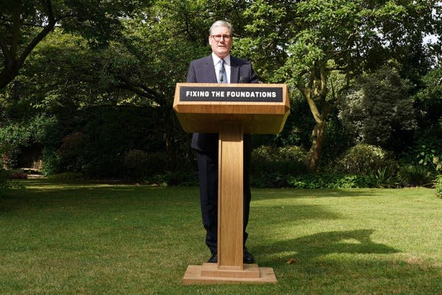 Sir Keir Starmer speaking in the Downing Street rose garden behind a lectern saying 'fixing the foundations'