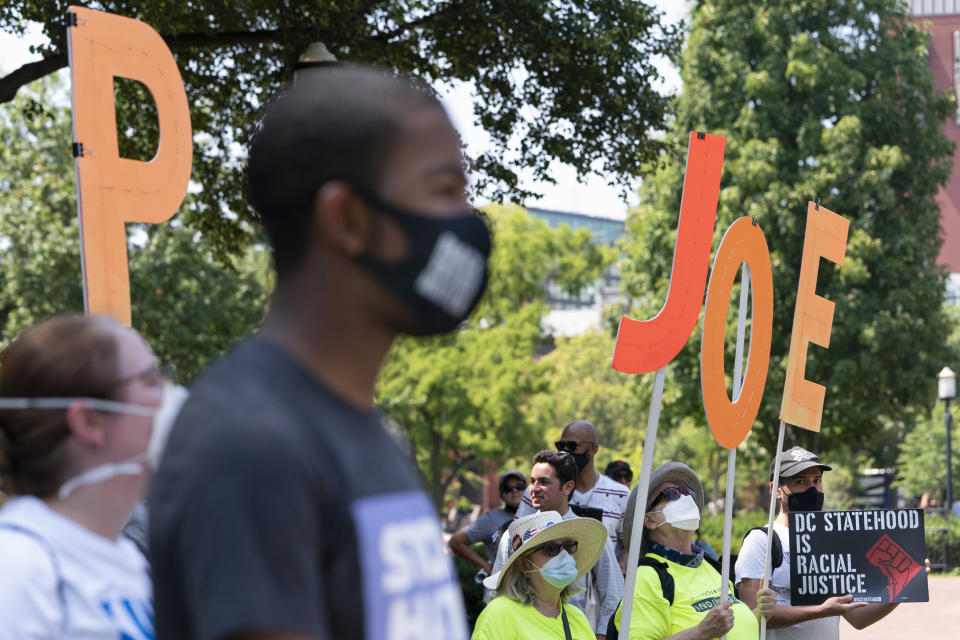 People rally for voting rights, including statehood for the District of Columbia, Tuesday, Aug. 24, 2021, near the White House in Washington. (AP Photo/Jacquelyn Martin)