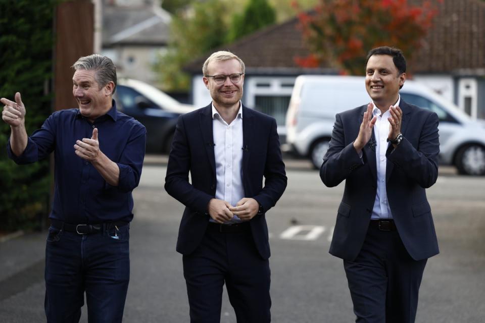 Sir Keir Starmer joined Anas Sarwar (R) and MP-elect Michael Shanks (C) to celebrate Shanks' victory (Getty Images)