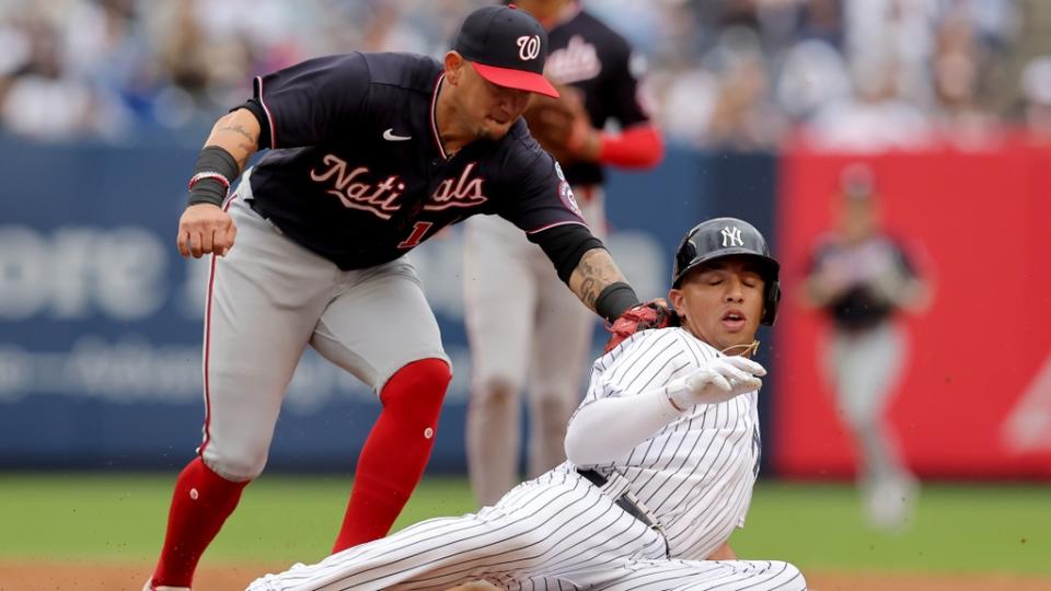 New York Yankees third baseman Oswald Peraza (91) is tagged out by Washington Nationals second baseman Ildemaro Vargas (14) in a rundown after being picked off first base during the second inning at Yankee Stadium.