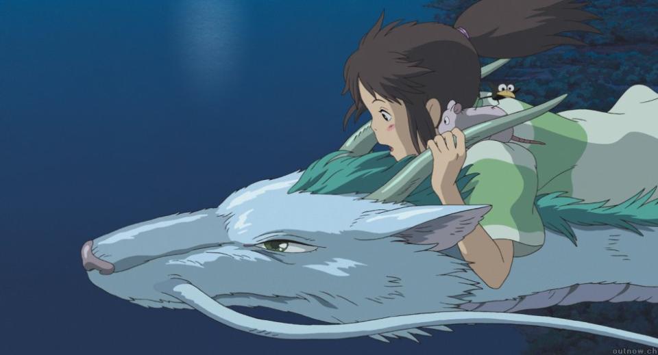 Chihiro rides on Haku's back as he flies them home. (Studio Ghibli)