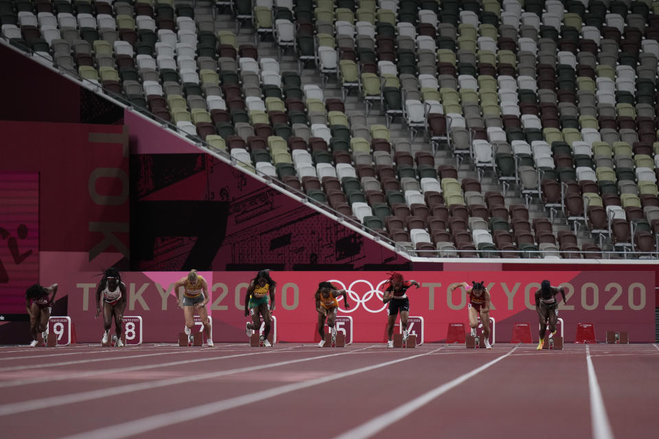 Marie-Josee Ta Lou, of Ivory Coast, wins a women's 100-meter semifinal at the 2020 Summer Olympics, Saturday, July 31, 2021, in Tokyo. (AP Photo/Petr David Josek)