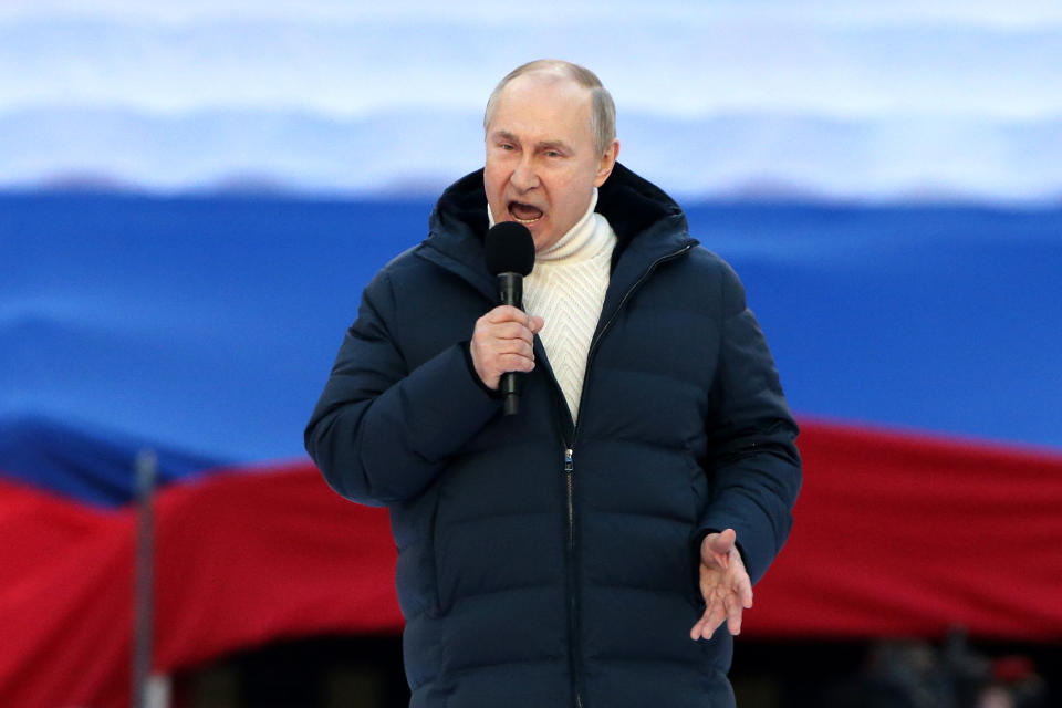 Russian President Vladimir Putin speaks during the a concert in Moscow.