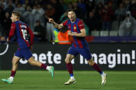 Barcelona's Robert Lewandowski celebrates scoring his side's second goal during a Spanish La Liga soccer match between Barcelona and Valencia at the Olimpic Lluis Companys stadium in Barcelona, Spain, Monday, April 29, 2024. (AP Photo/Joan Monfort)