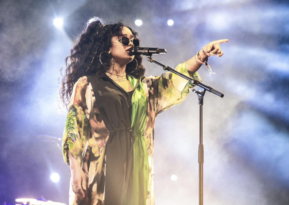 FILE - This April 14, 2019 file photo shows H.E.R. performing at the Coachella Music & Arts Festival in Indio, Calif. H.E.R., who scored five nominations at last year’s Grammys, including a bid for best new artist, returns this year with five more nominations. (Photo by Amy Harris/Invision/AP, File)