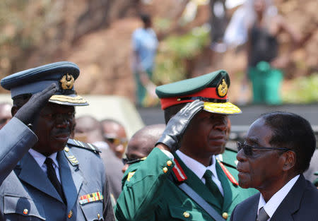 President Robert Mugabe arrives to address mourners gathered for the funeral of former cabinet minister and ZANU-PF member Cephas Msipa in Harare, Zimbabwe, October 22, 2016. REUTERS/Philimon Bulawayo