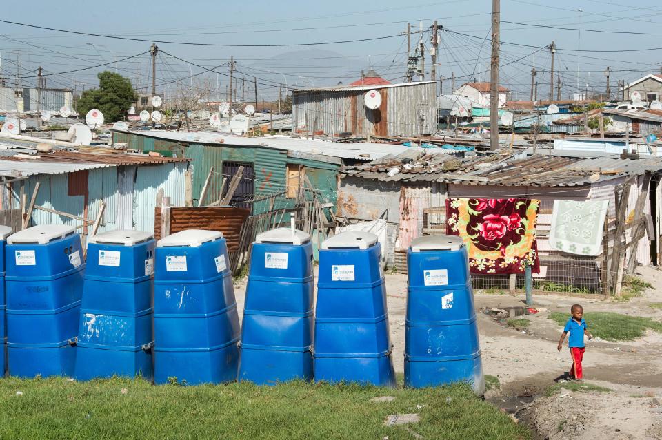<p>Portable toilets at a settlement in Khayelitsha, a township outside of Cape Town, South Africa. (Photo: Rodger Bosch/AFP/Getty Images) </p>