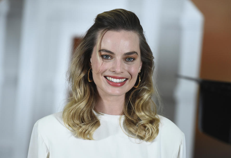 FILE - This July 11, 2019 file photo shows Margot Robbie at the photo call for "Once Upon a Time in Hollywood" in Los Angeles. The film opens on July 26. (Photo by Jordan Strauss/Invision/AP, File)