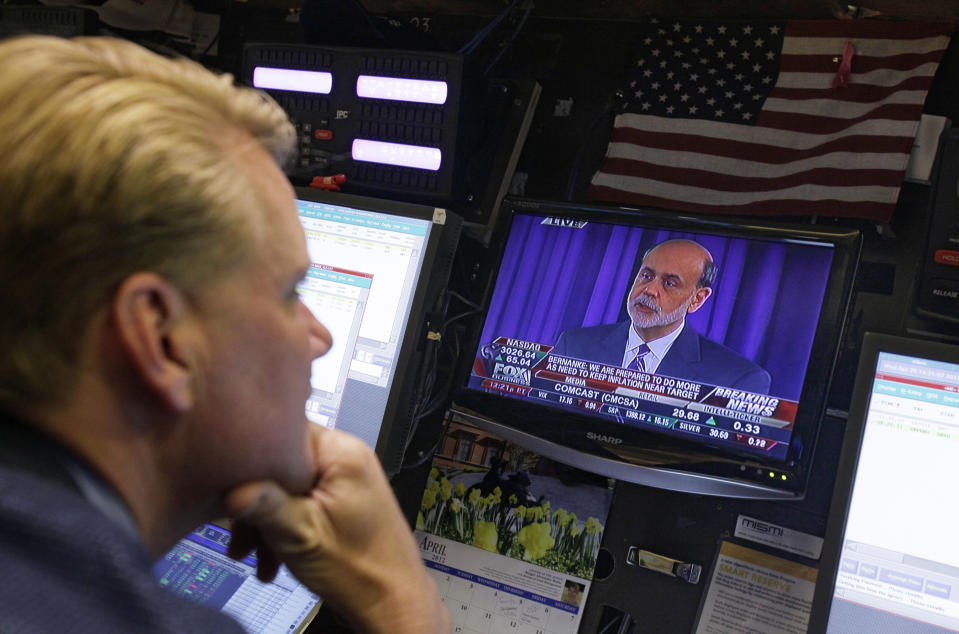 Federal Reserve Chairman Ben Bernanke is broadcast on a television screen on the trading floor of the New York Stock Exchange, Wednesday, April 25, 2012. Bernanke says further bond purchases by the Fed remain "very much on the table" if the economy needs further support. (AP Photo/Richard Drew)