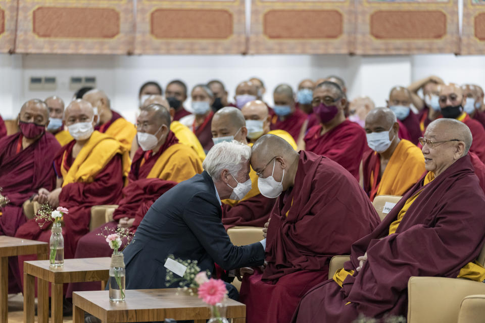 Hollywood actor Richard Gere, left, greets Ling Rinpoche, a prominent Tibetan Buddhist leader, during the inauguration of a museum by the Dalai Lama in Dharmsala, India, Wednesday, July 6, 2022. Exile Tibetans also celebrated Dalai Lama's 87th birthday today. (AP Photo/Ashwini Bhatia)