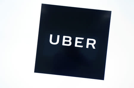 Uber's logo is pictured at its office in Tokyo, Japan, November 27, 2017. REUTERS/Kim Kyung-Hoon