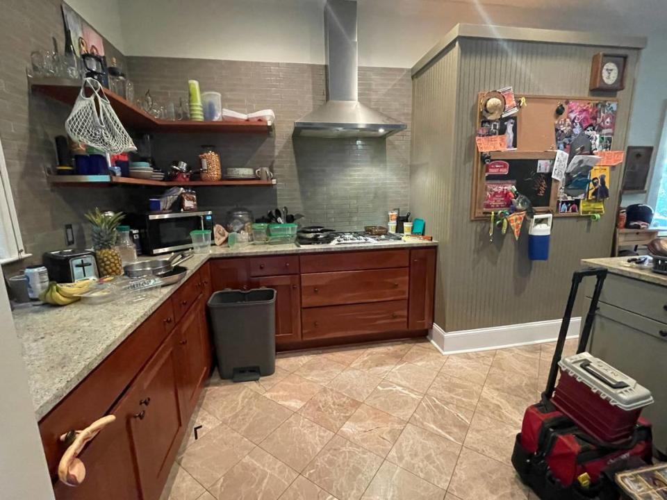 During filming of “Please Don’t Destroy: The Treasure of Foggy Mountain,” the kitchen in the home of Zack Albert and Becca Bellamy was remade to reflect a more cluttered version of a home three men in their twenties might share. Note that the oven on the right was completely covered by paneling.