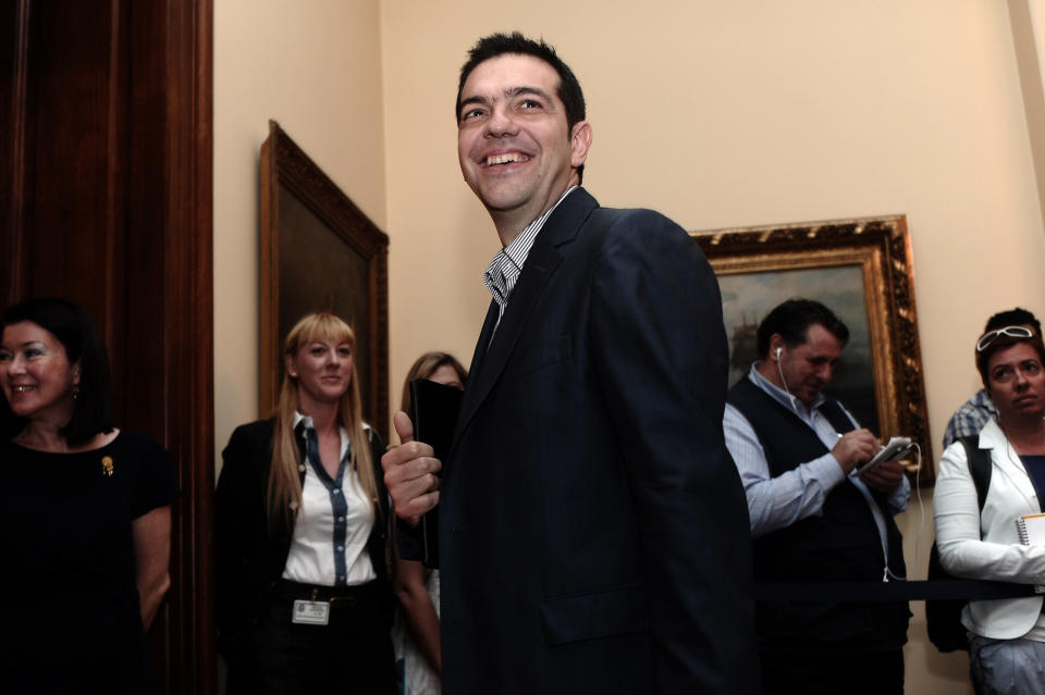 Leader of the Coalition of the Radical Left party Alexis Tsipras arrives for a political party leaders meeting at the Presidential Palace in Athens, on Tuesday, May 15, 2012. Greece's president met the leaders of five political parties, broadening talks to try and form a coalition government and end a nine-day deadlock in the crisis-hit country. (AP Photo/Aris Messinis, pool)