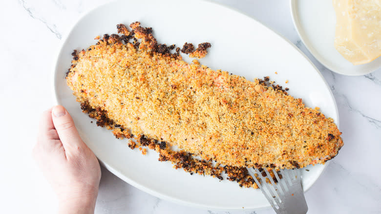 breadcrumb crusted salmon on white platter