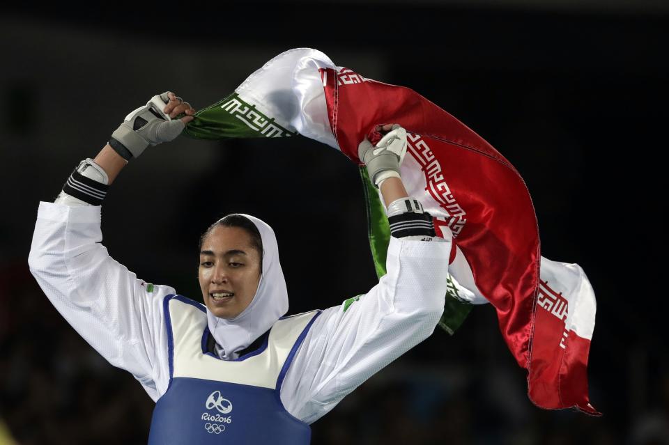 FILE - In this Aug. 18, 2016 file photo, Kimia Alizadeh Zenoorin of Iran celebrates after winning the bronze medal in a women's Taekwondo 57-kg competition at the 2016 Summer Olympics in Rio de Janeiro, Brazil. Zenoorin, Iran's only female Olympic medalist, said she defected from the Islamic Republic in a blistering online letter that describes herself as “one of the millions of oppressed women in Iran.” (AP Photo/Andrew Medichini, File)