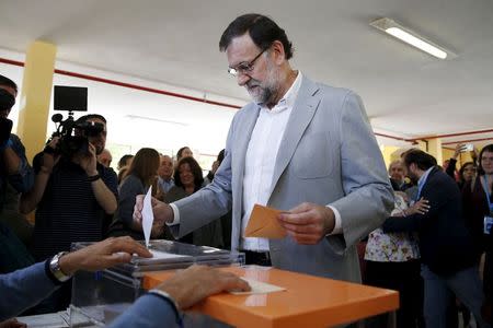 Spain's Prime Minister Mariano Rajoy votes at a polling station during regional and municipal elections in Madrid, Spain, May 24, 2015. REUTERS/Juan Medina