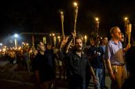 <p>Neo Nazis, Alt-Right, and White Supremacists march through the University of Virginia Campus with torches in Charlottesville, Va., on Aug. 11, 2017. (Photo: Samuel Corum/Anadolu Agency/Getty Images) </p>