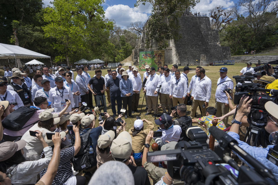 Taiwan's President Tsai Ing-wen and Guatemala's President Alejandro Giammattei, speak with reporters during their visit to the Mayan site Tikal, in Peten, Guatemala, Saturday, April 1, 2023. Tsai is in Guatemala for an official three-day visit. (AP Photo/Moises Castillo)