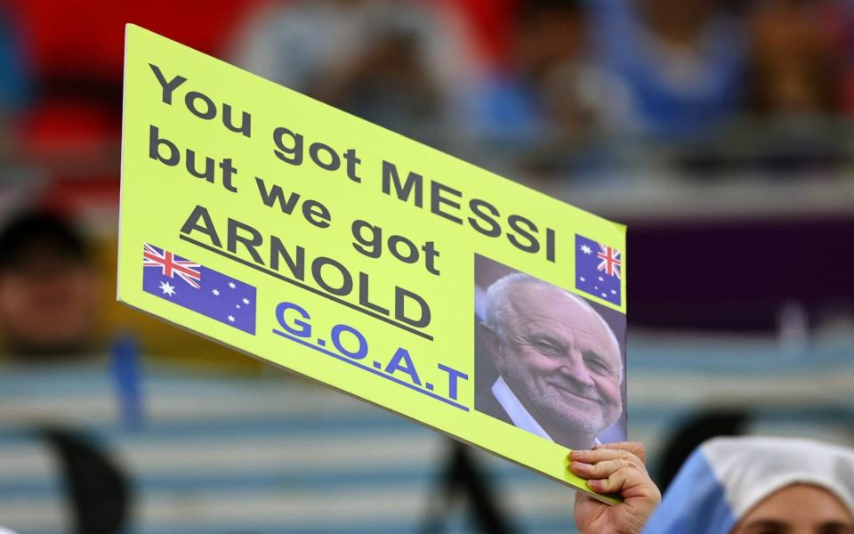 A fan holds up a banner about Graham Arnold the head coach / manager of Australia prior to the FIFA World Cup Qatar 2022 - Getty Images