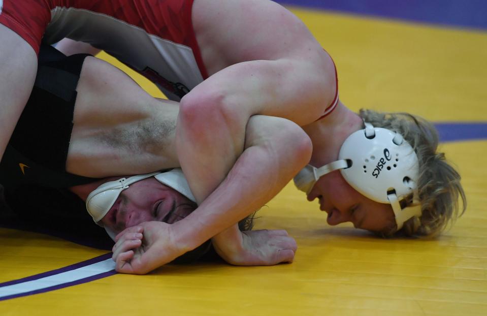 Roland-Story's Hesston Johnson goes for pinned Green County's Nathan Black during their 160-pound wrestling final in the HOI Conference  wrestling tournament at Nevada High School Friday, Jan. 21, 2022, in Nevada, Iowa.