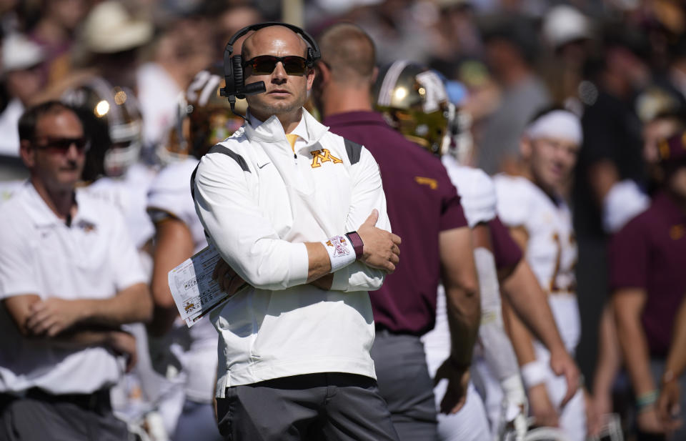 Minnesota head coach P.J. Fleck looks on during the first half of an NCAA college football game against Colorado, Saturday, Sept. 18, 2021, in Boulder, Colo. (AP Photo/David Zalubowski)