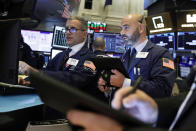 Specialist Anthony Rinaldi, left, and trader Fred DeMarco work on the floor of the New York Stock Exchange, Tuesday, Nov. 12, 2019. Stocks are opening slightly higher on Wall Street, led by gains in technology and health care companies. (AP Photo/Richard Drew)