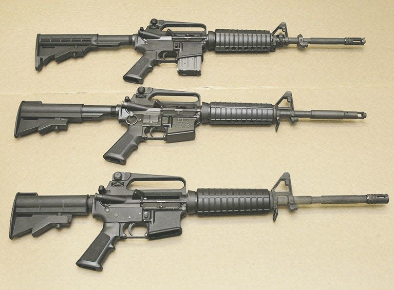 Three variations of the AR-15 assault rifle displayed at the California Department of Justice in Sacramento, Calif. in this file photo. None of these are the gun that was used in the New Year's Eve shooting that left a southwest Canton man dead. Rich Pedroncelli \ Associated Press.