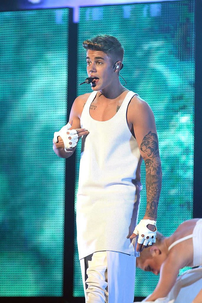 Justin performing onstage with bangs