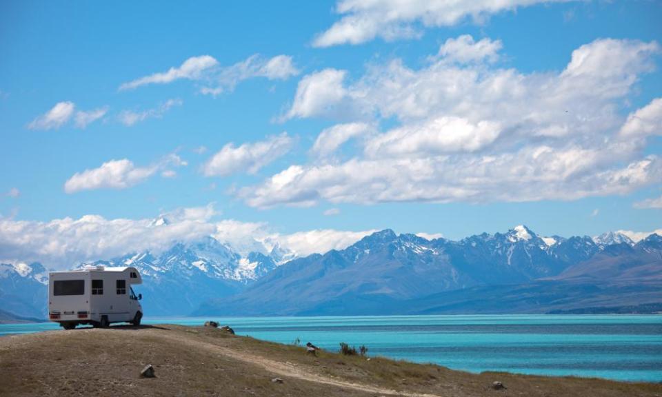 campervan parked by lake in new zealand