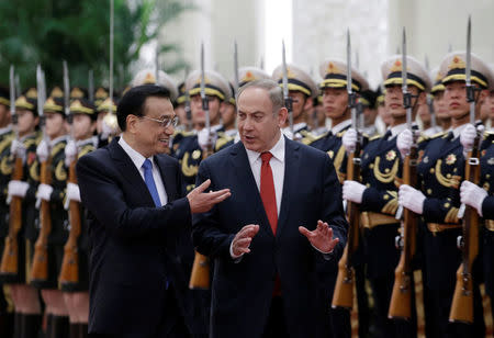 Israeli Prime Minister Benjamin Netanyahu (R) and China's Premier Li Keqiang attend a welcoming ceremony at the Great Hall of the People in Beijing, China March 20, 2017. REUTERS/Jason Lee