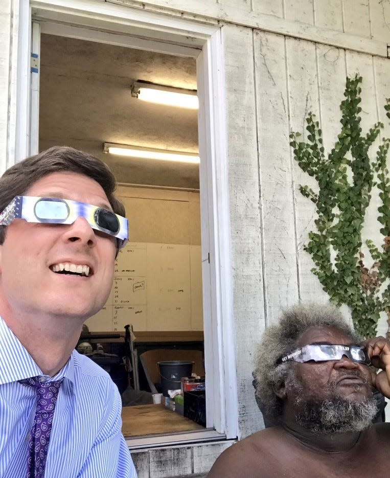 Columbia Mayor Chaz Molder and Melvin Taylor enjoy a moment as they try on protective eye glasses on August 21, 2017, when a solar eclipse occurred visible by locations in the U.S., including Middle Tennessee.