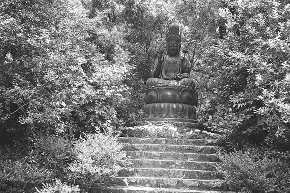 Buddhist shrine on top of granite steps.