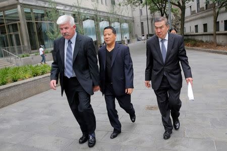 Macau real estate developer Ng Lap Seng (C), accused of bribing former United Nations General Assembly president John Ashe, exits U.S Federal Court in the Manhattan borough of New York, U.S., June 27, 2016. REUTERS/Andrew Kelly