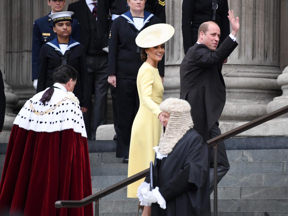Kate Middleton and Prince William wave outside St Paul's Cathedral.