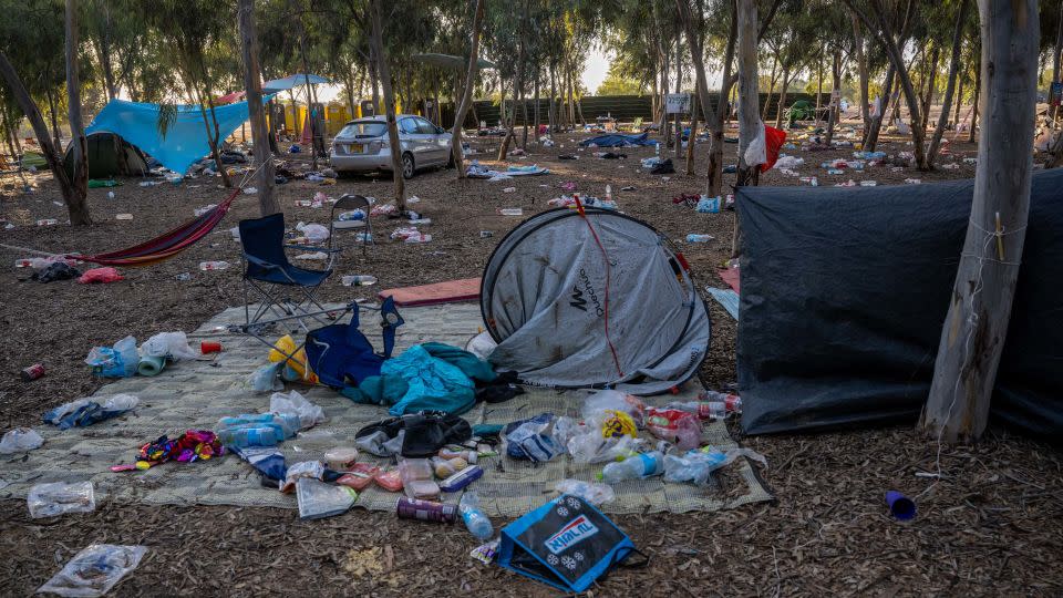 Damaged cars and personal effects are left scattered around the Supernova Music Festival site, where hundreds were killed and dozens taken by Hamas militants near the border with Gaza, pictured on October 13. - Alexi J. Rosenfeld/Getty Images/File