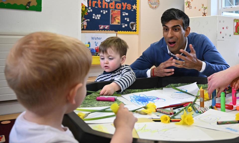 <span>Rishi Sunak visiting a nursery. The report expresses concern there was no consultation with the early years sector before the 2023 budget.</span><span>Photograph: Paul Ellis/AFP/Getty Images</span>