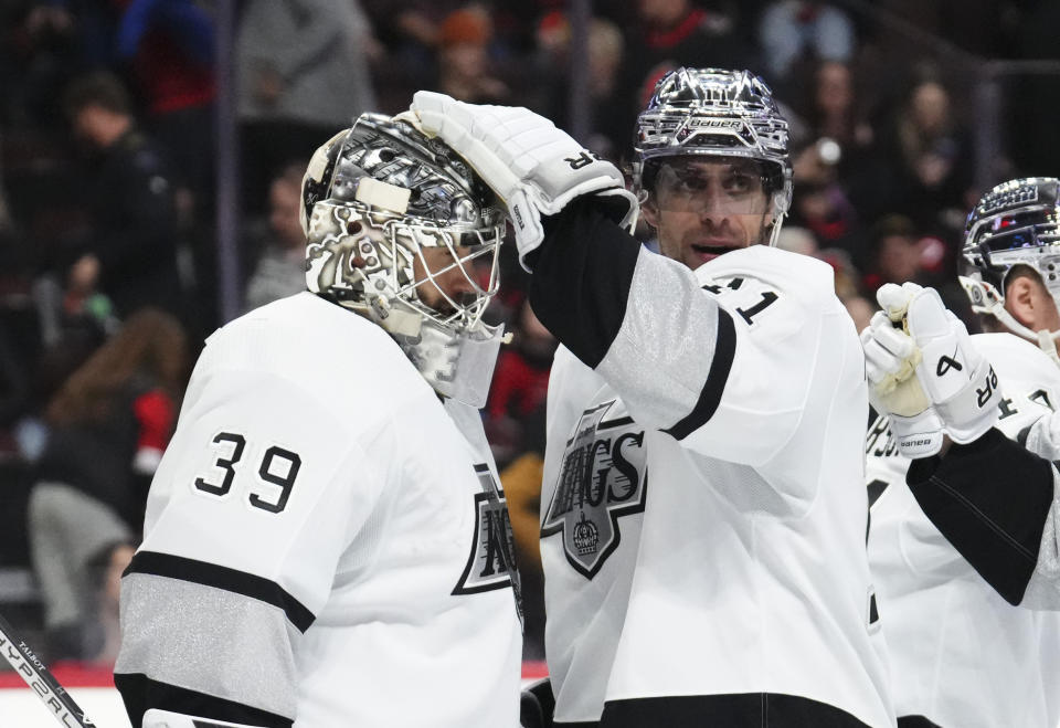 Los Angeles Kings centre Anze Kopitar (11) gives goaltender Cam Talbot (39) a pat on the head after the team's win over the Ottawa Senators in an NHL hockey game Thursday, Nov. 2, 2023, in Ottawa, Ontario. (Sean Kilpatrick/The Canadian Press via AP)
