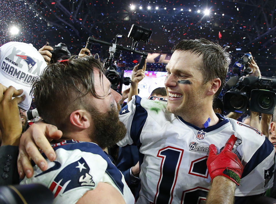 GLENDALE, AZ - FEBRUARY 01:  Tom Brady #12 and  Julian Edelman #11 of the New England Patriots celebrate after defeating the Seattle Seahawks 28-24 to win Super Bowl XLIX at University of Phoenix Stadium on February 1, 2015 in Glendale, Arizona.  (Photo by Tom Pennington/Getty Images)