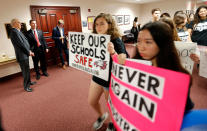 <p>Student survivors from Marjory Stoneman Douglas High School, where more than a dozen students and faculty were killed in a mass shooting on Wednesday, walk past the house legislative committee room, to talk to legislators at the state Capitol, regarding gun control legislation, in Tallahassee, Fla., Wednesday, Feb. 21, 2018. (Photo: Gerald Herbert/AP) </p>