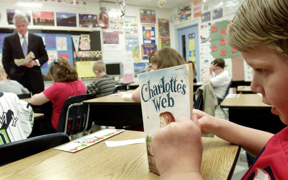 A student reads "Charlotte's Web."
