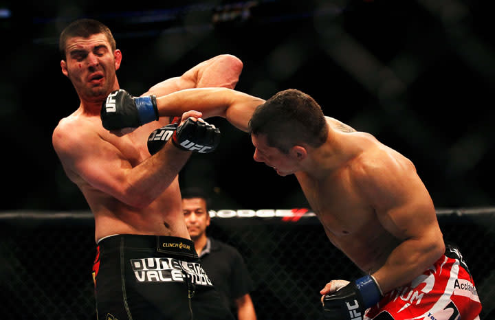 ATLANTA, GA - APRIL 21: Chris Clements (R) hits Keith Wisniewski during their welterweight bout for UFC 145 at Philips Arena on April 21, 2012 in Atlanta, Georgia.