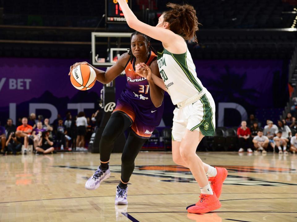 2021 WNBA leading scorer Tina Charles drives on Seattle Storm superstar Breanna Stewart.