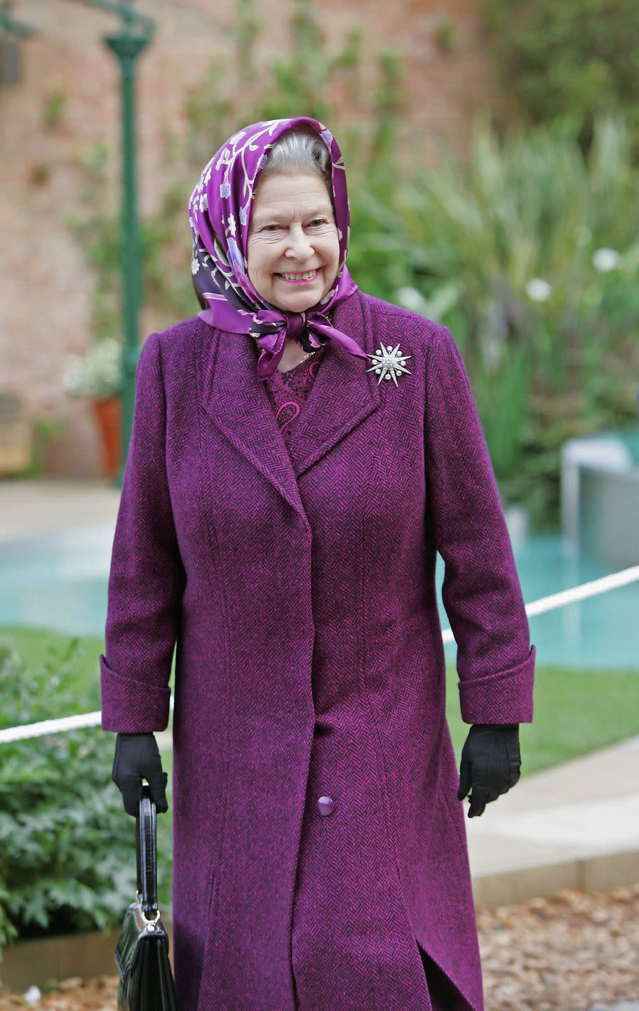 When the Queen isn't wearing a hat, she still covers her head.