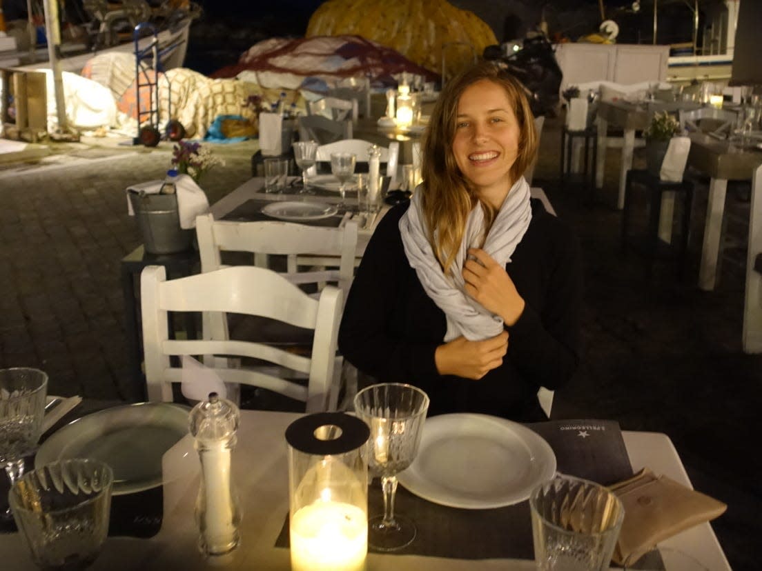 Kara Panzer sitting at a table at an outdoor restaurant