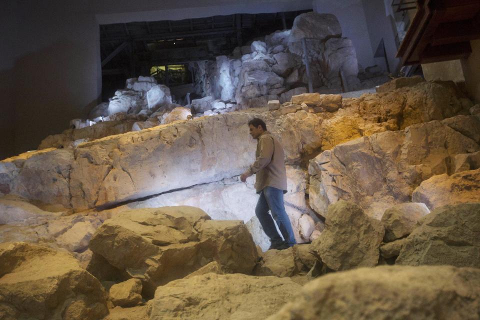 In this Thursday, May 1, 2014, photo, Eli Shukron, an archeologist formerly with Israel's Antiquities Authority, walks in the City of David archaeological site near Jerusalem's Old City. Shukron, who excavated at the site for nearly two decades, says he has found the legendary citadel captured by King David in his conquest of Jerusalem. But archaeologists are divided on identifying Davidic sites in Jerusalem, the city he is said to have made his capital. (AP Photo/Sebastian Scheiner)